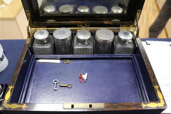 A Victorian brass mounted coromandel wood travelling toilet box with ten silver mounted toilet jars